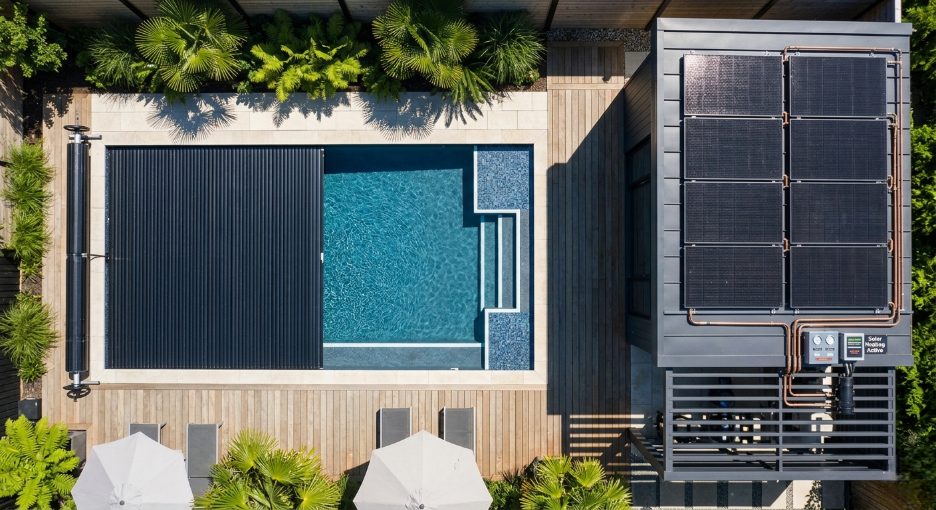 Energy-efficient pool with solar heating panels and a pool cover designed for extended seasonal use