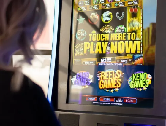woman playing video lottery