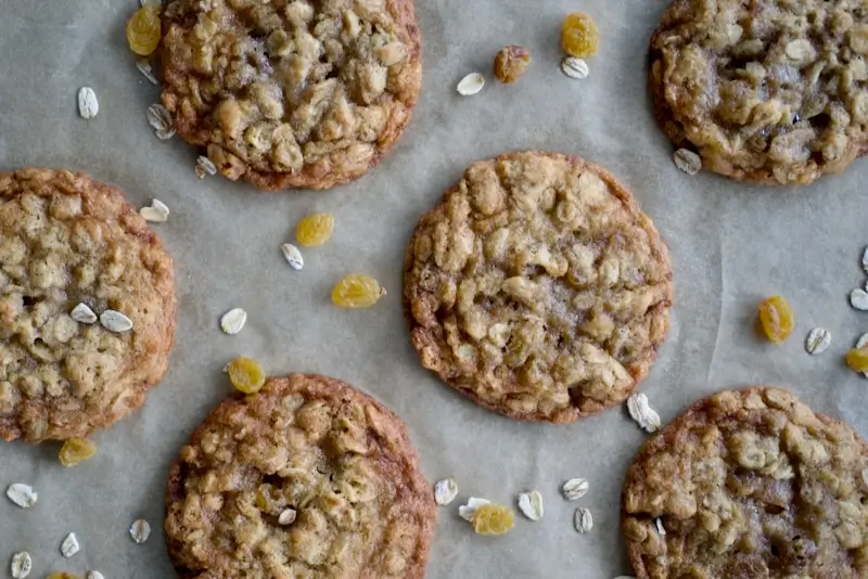 Oatmeal golden raisin cookies on a baking sheet