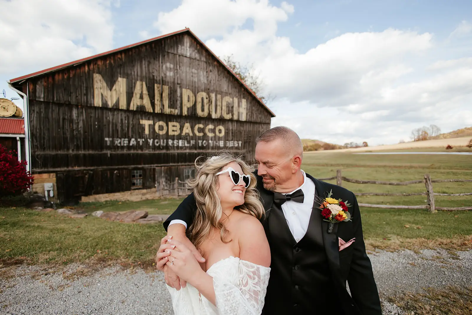 Couple portrait at the Mail Pouch barn