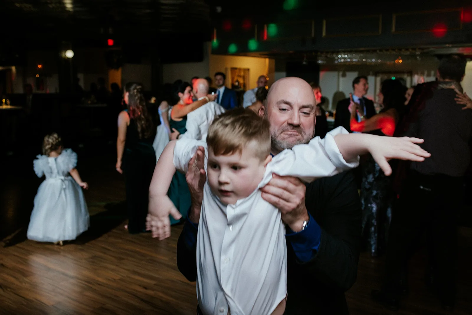 Children taking over the photo booth at a wedding reception