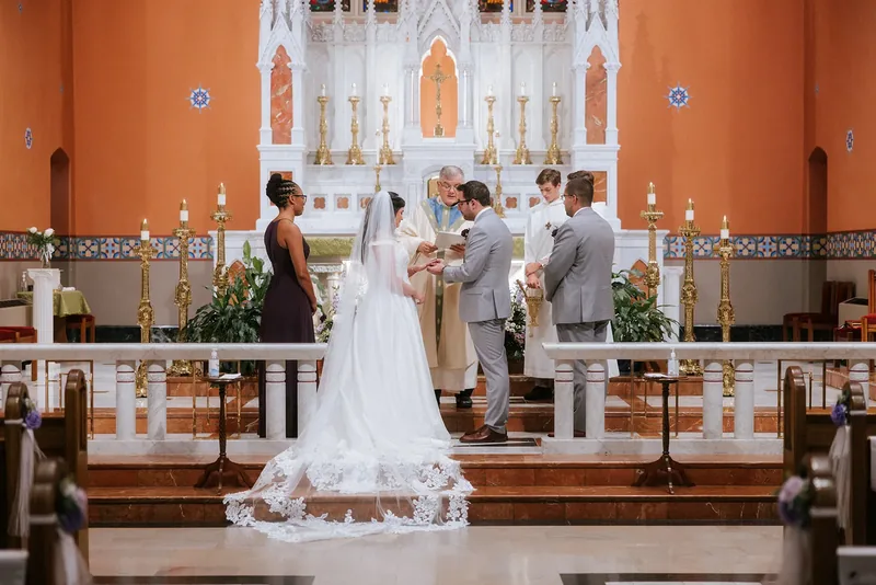 Bride and groom exchanging vows at the church altar