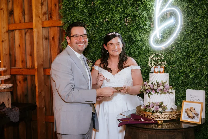 Bride and groom cutting their wedding cake together.