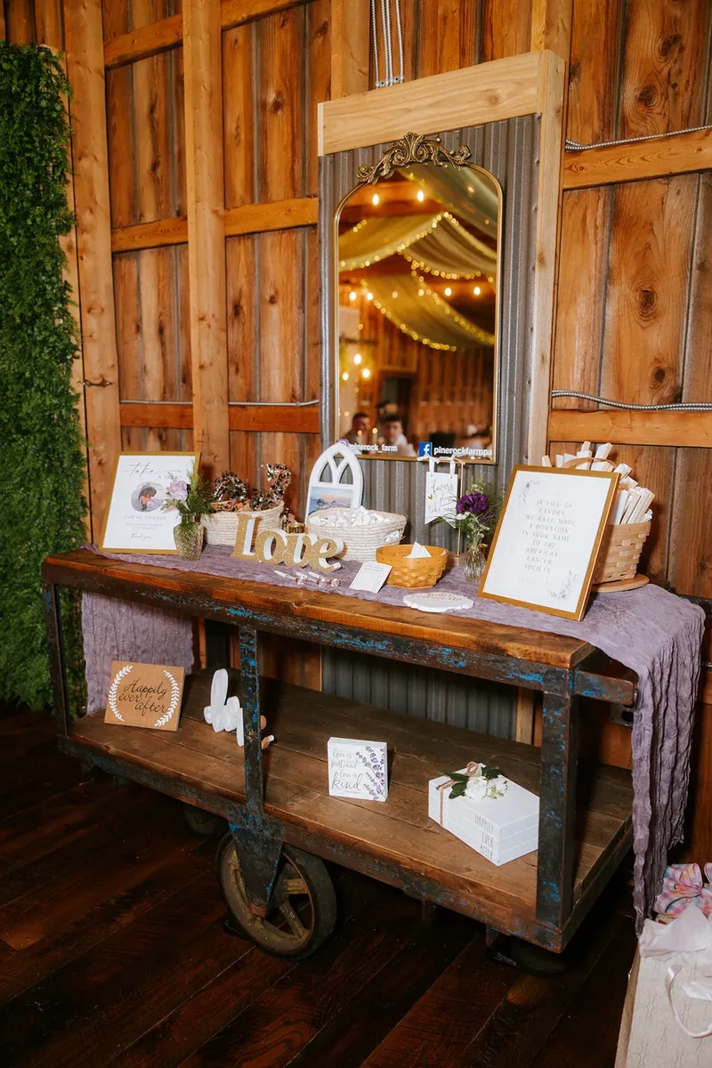 Wedding welcome table with framed signs, cards and flowers.