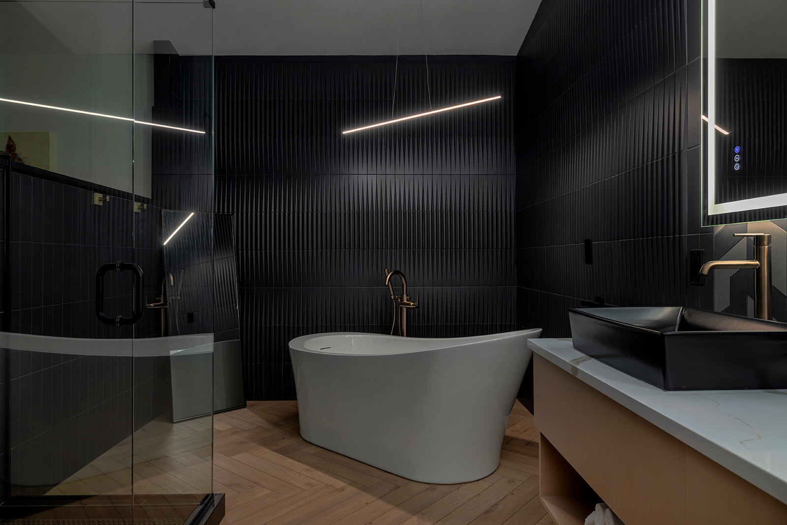 Suite bathroom with freestanding tub, glass shower and black vessel sink
