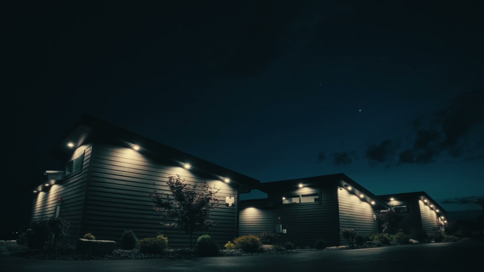 Grotto Resort suites illuminated at dusk