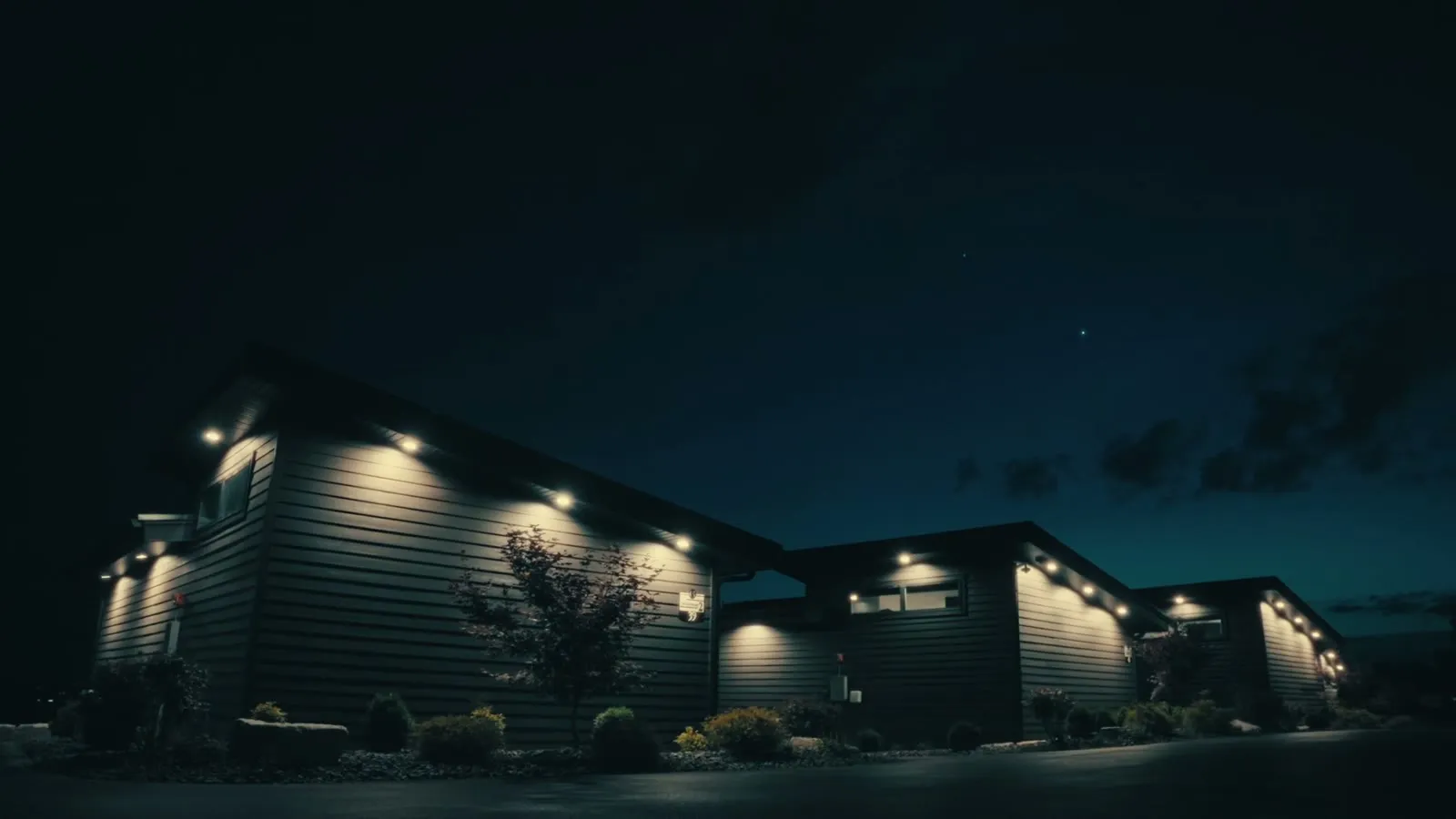 Grotto Resort suites illuminated at dusk