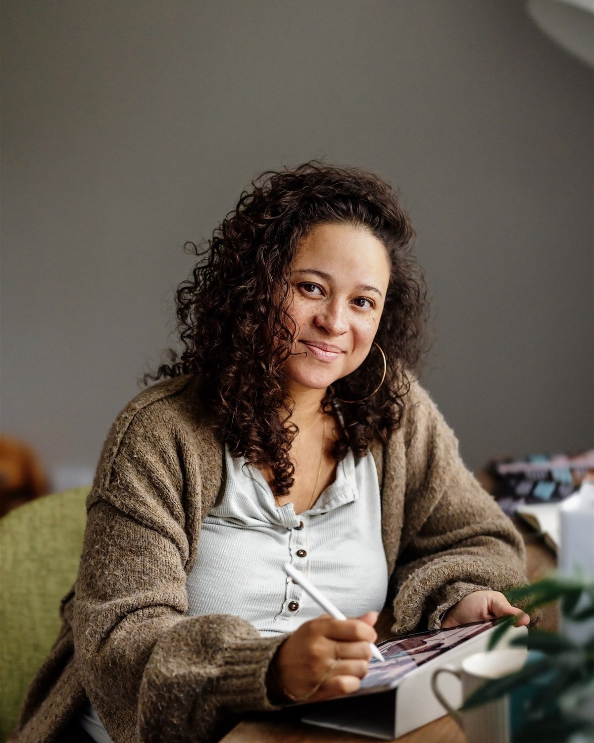 Cheyenne Varner, founder of The Educated Birth, sketching at her desk