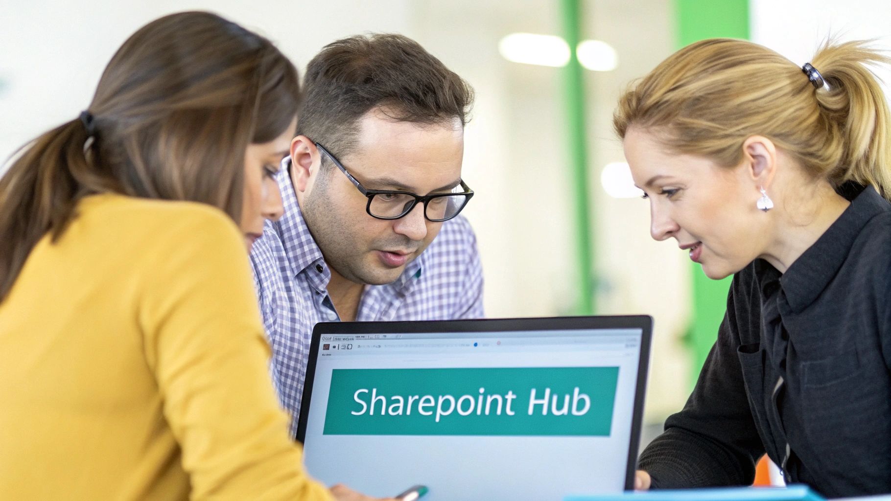 A team collaborating in a modern office with digital tools, representing SharePoint's role in marketing operations
