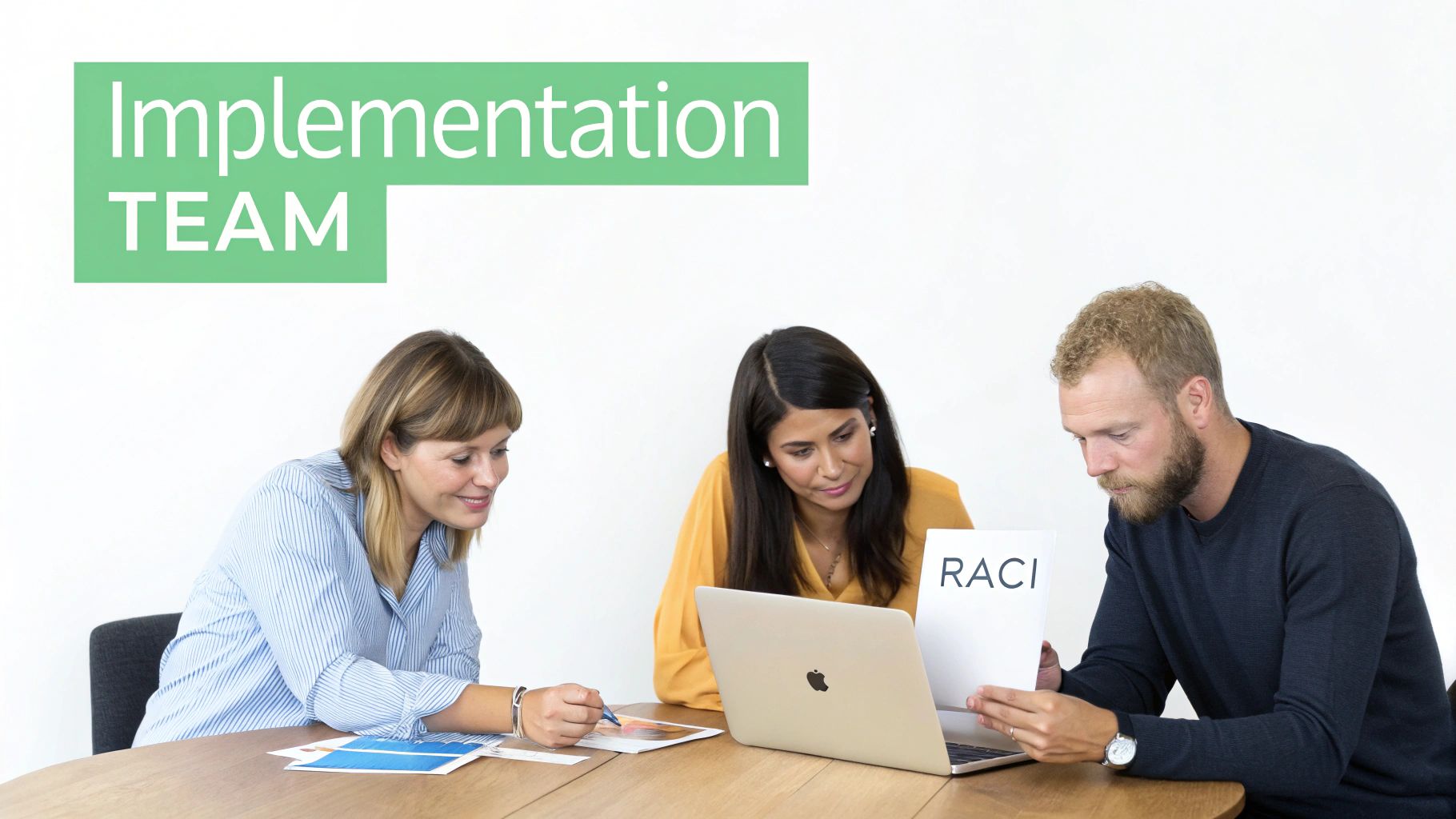 Three colleagues, two women and a man, discussing a RACI chart during an implementation team meeting.