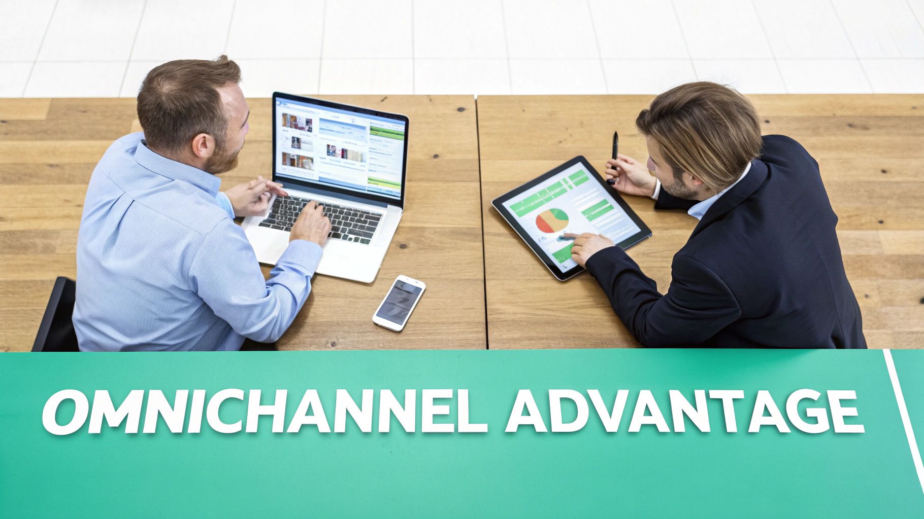 Two men collaborate on a laptop and tablet, demonstrating an omnichannel advantage strategy.