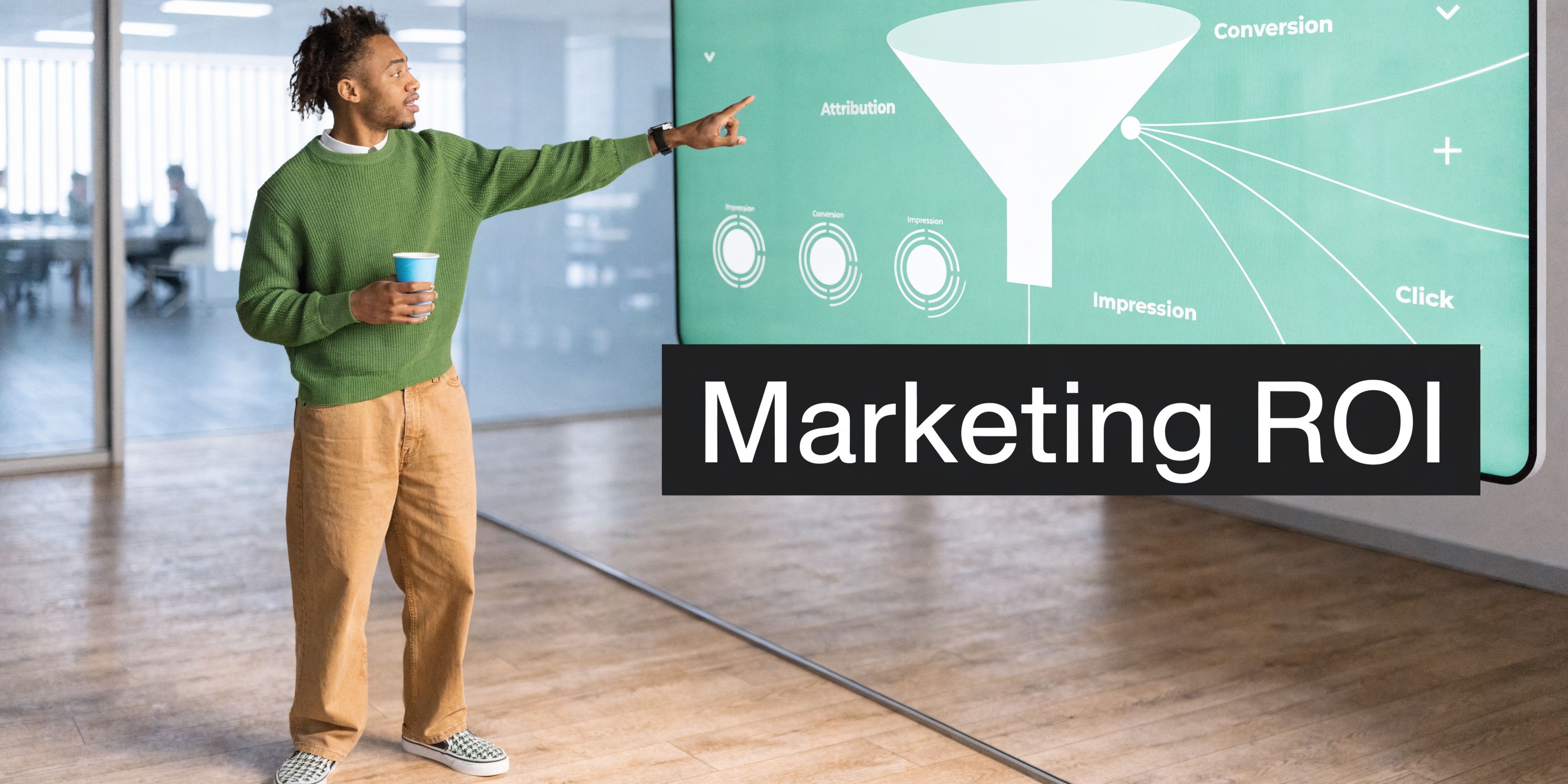 A professional man explaining a marketing ROI funnel diagram during a business presentation in an office.