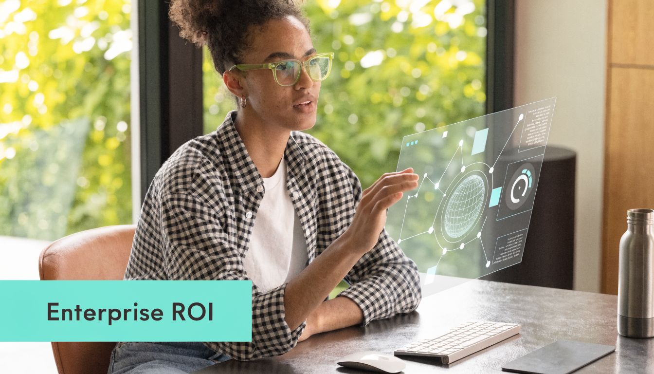 A young woman interacting with a futuristic digital holographic display of business data at her desk.