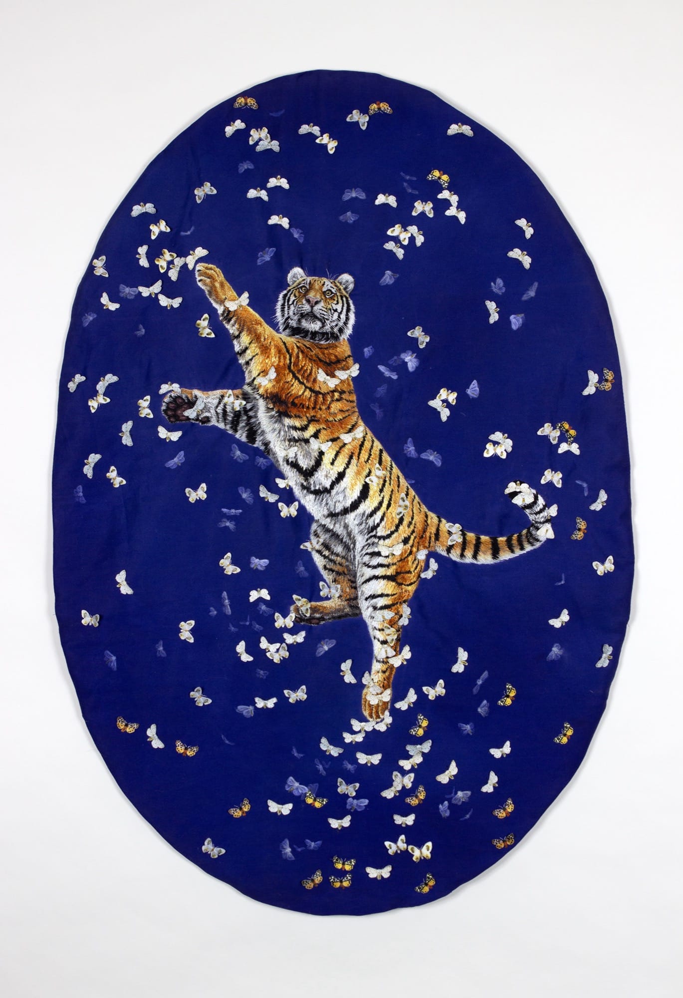 Deborah Simon, Tiger/Moth, (2025). Hand embroidered silk on cotton, acrylic paint, 35 in x 23 in.