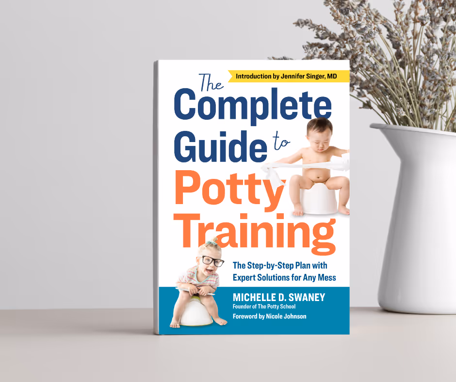Potty Training book by The Potty School CEO standing up with lavender next to it.