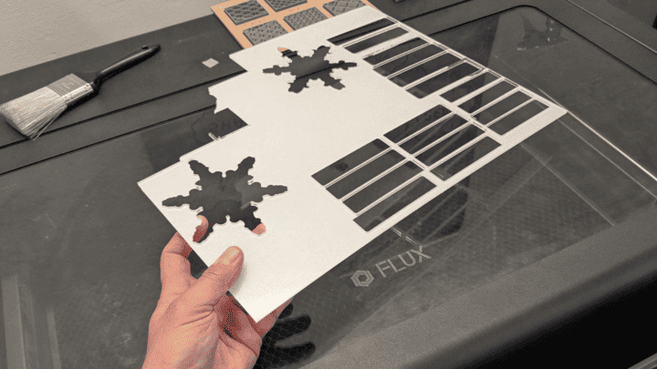 A piece of acrylic cut out by a flux inc. laser cutter