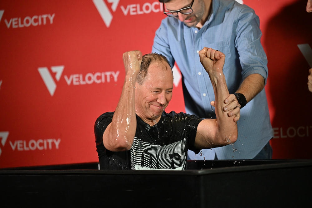 A man gets baptized by Pastor Jacob.