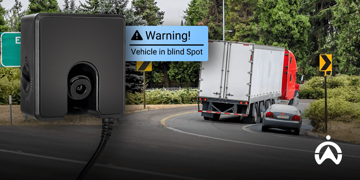 Cartrack AI truck dashcam displaying a warning for a vehicle in blind spot.