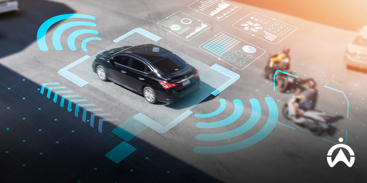 Cartrack car technology advancements showing smart car with digital overlays in urban parking.