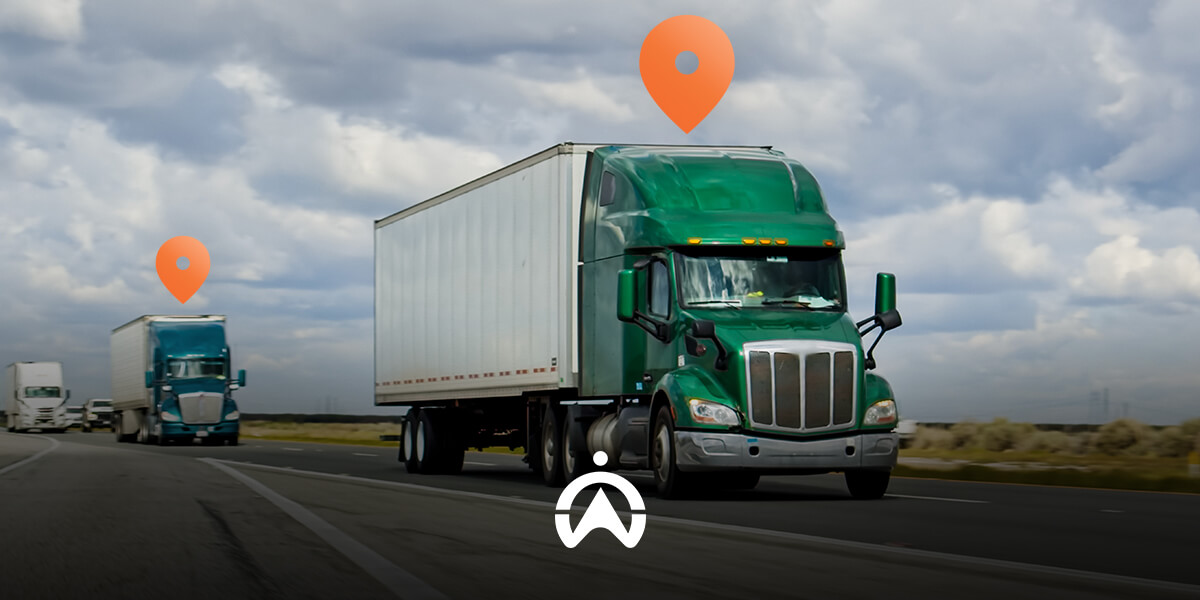 Two green semi-trucks on a highway, with location markers above them and a cloudy sky in the background.