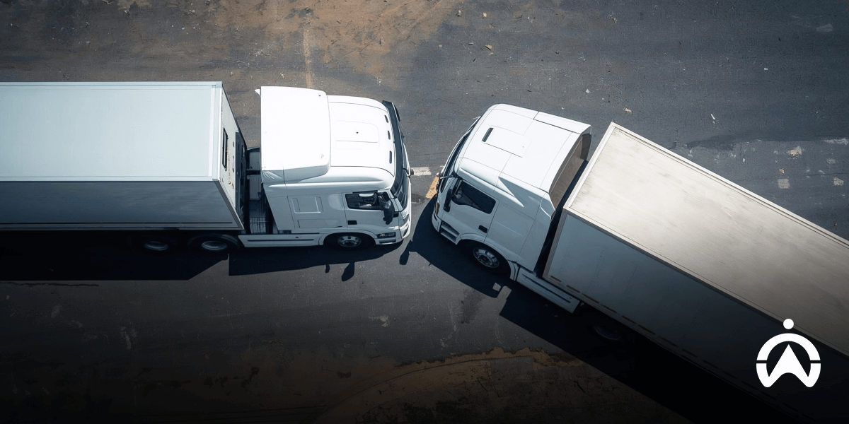 Bird’s-eye view of two trucks parked closely, illustrating collision avoidance vs crash detection scenarios.