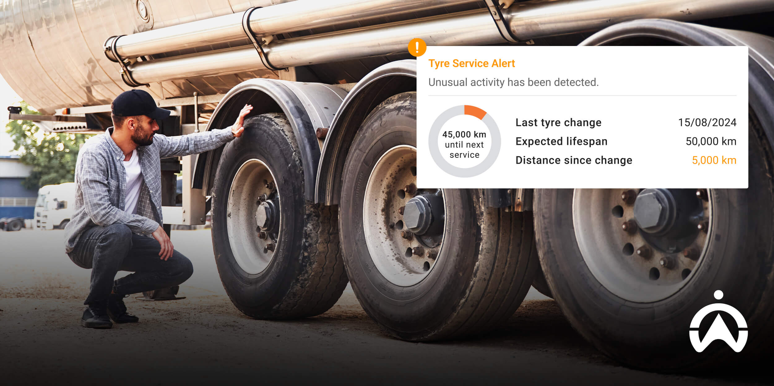 A person inspecting vehicle tyres with service alert supported by fleet maintenance management software.