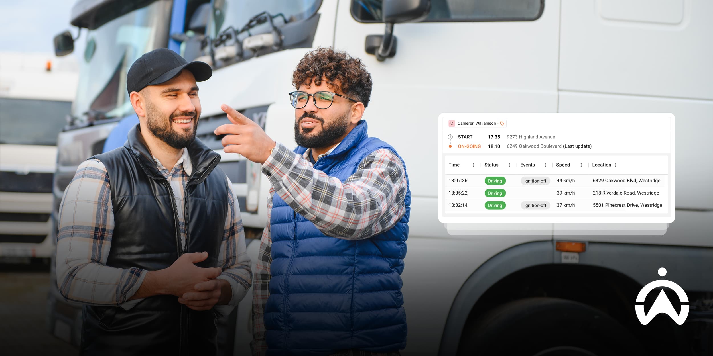 Team discussing truck data and locations using custom fleet management software.