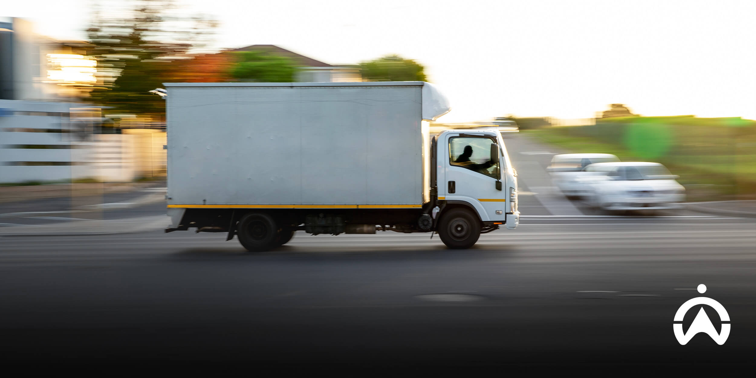 Delivery truck in motion at intersection, reflecting AARTO Act road compliance.