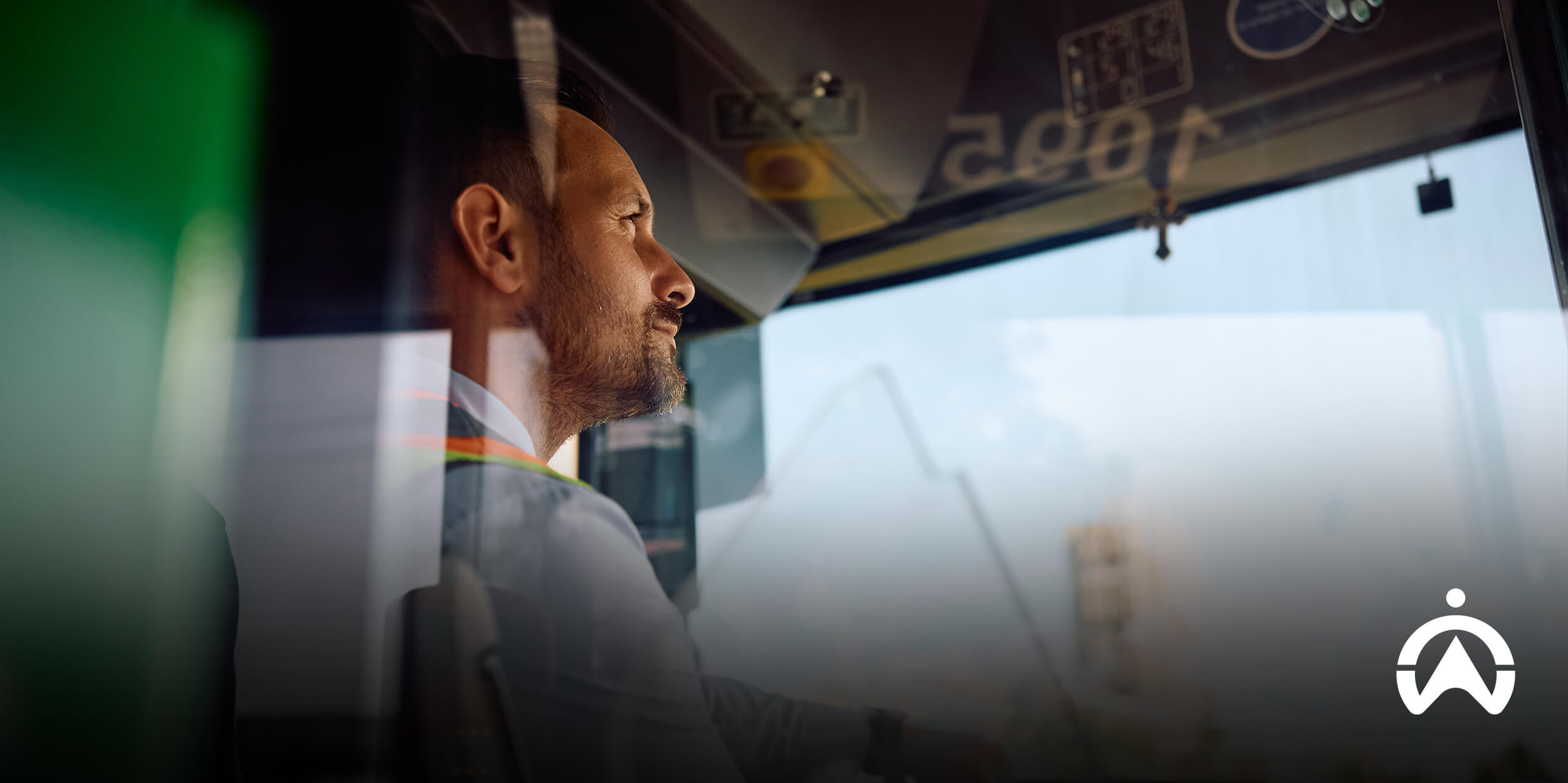 Bus driver navigating route, supported by tourism fleet management system.