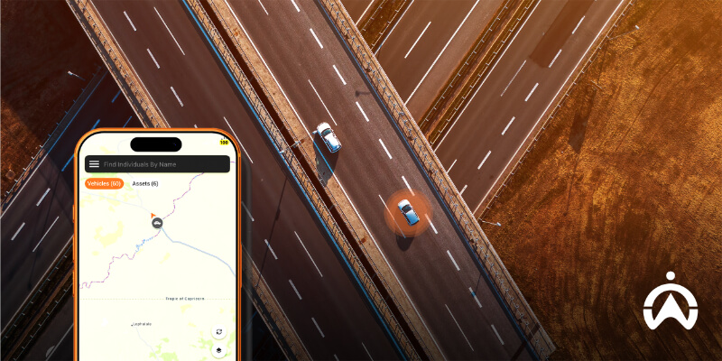 Aerial view of a highway with cars and a smartphone interface displaying essential car safety tracking features.