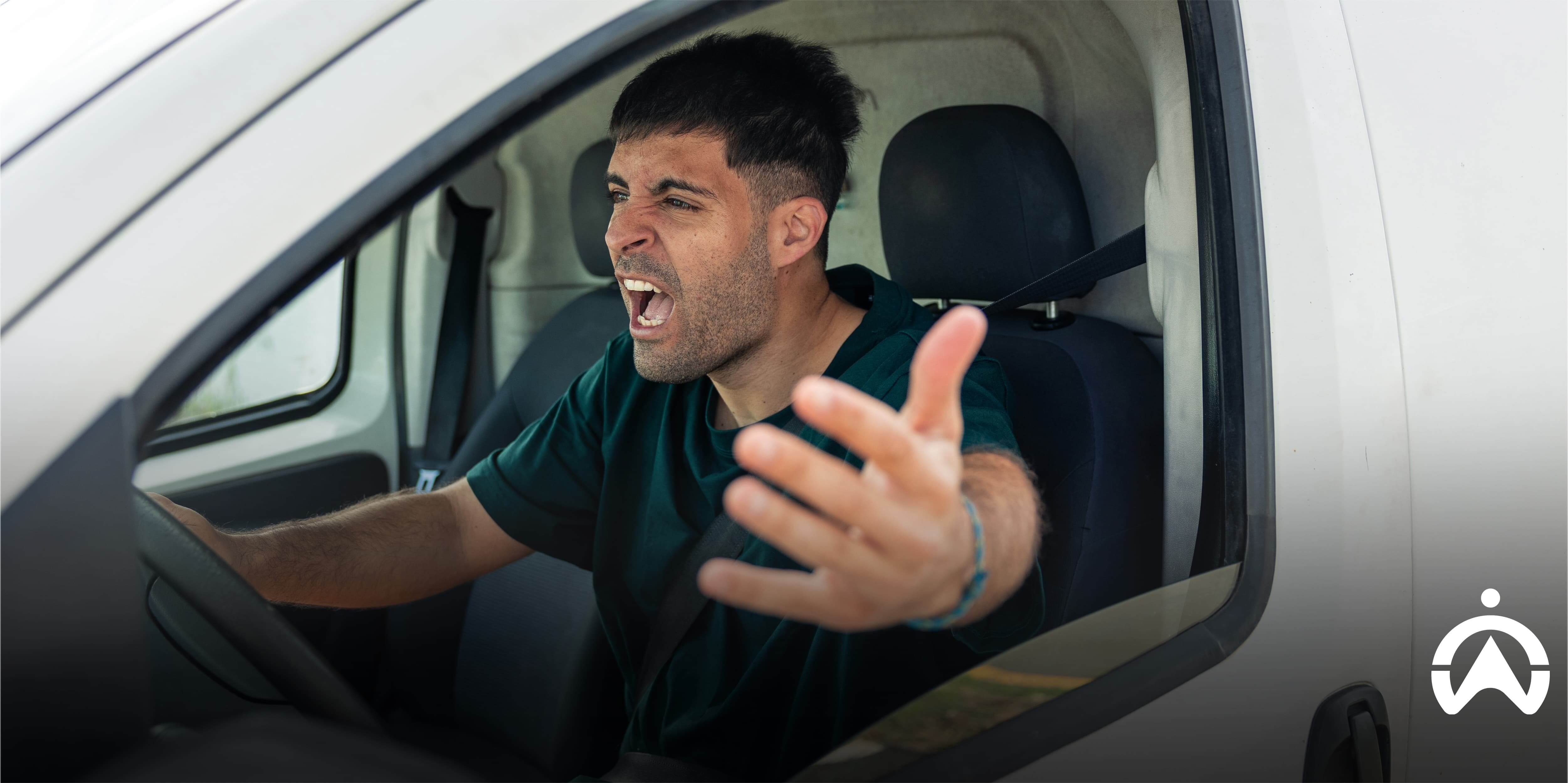 Driver reaching out through a car window during a tense road interaction, illustrating how to instantly deal with road rage safely and calmly
