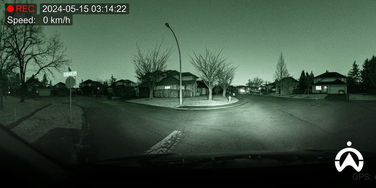 Nighttime dashcam view at a quiet intersection, illustrating common mistakes to avoid when using a dashcam for clear video recording and road visibility