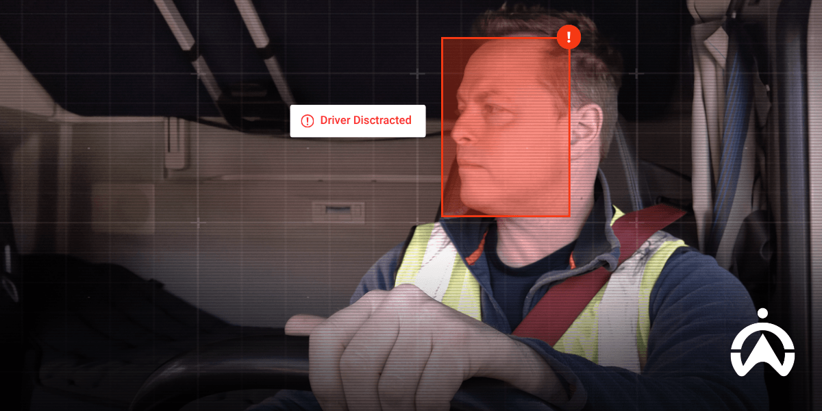 Truck driver detected by in-cab alert system, showing how a dashcam can reduce insurance through improved driver monitoring and safety