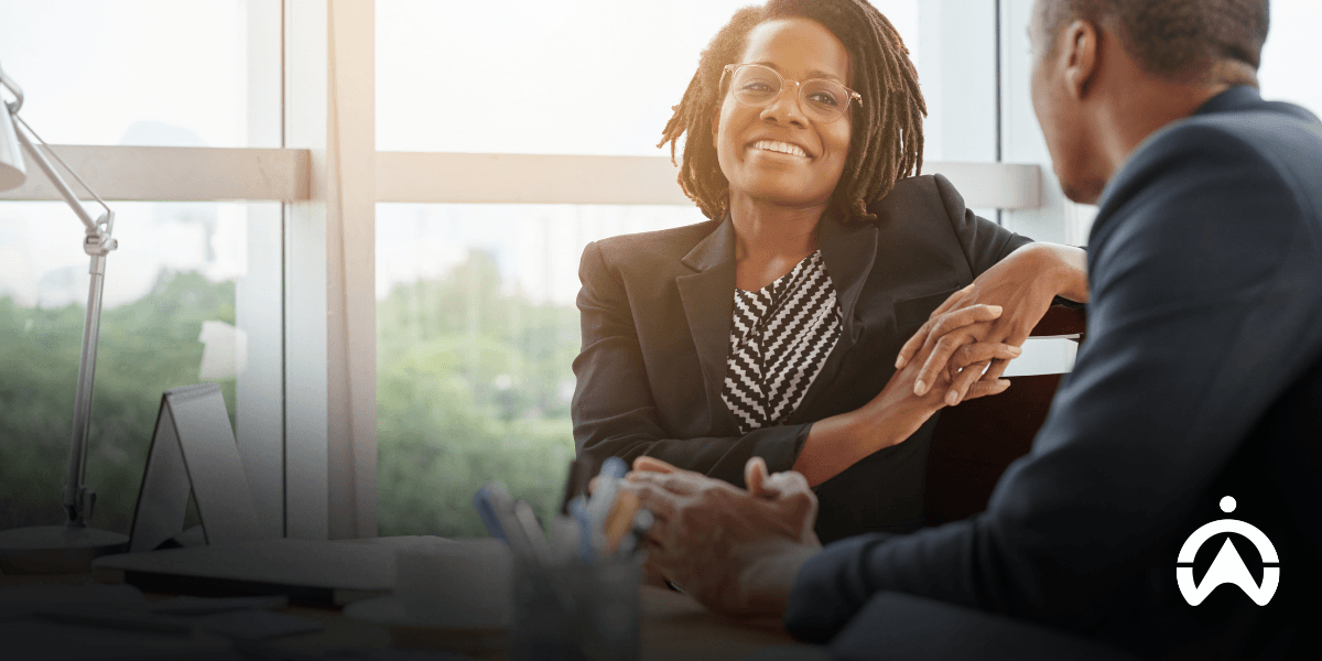 Business professionals discussing financial records and fleet tax season planning in a modern office.