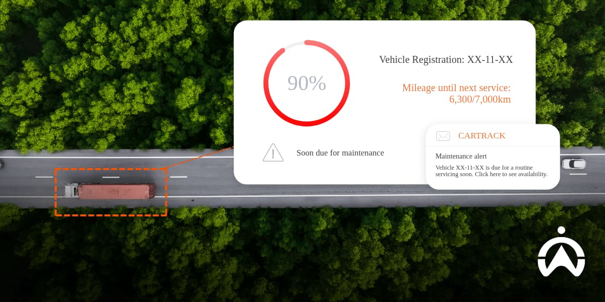 Aerial view of a truck on a forest road with a maintenance alert, illustrating CO₂ Tracking Tools for Modern Fleet Management.