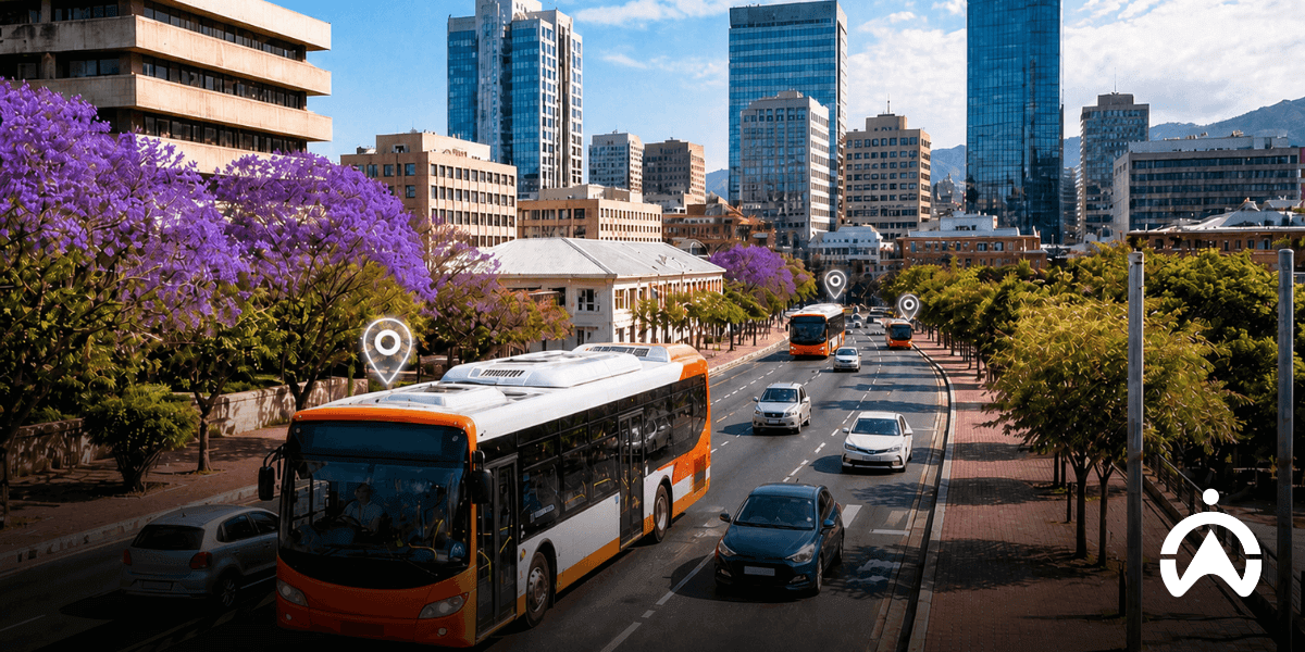 3 buses and cars travelling along a busy street