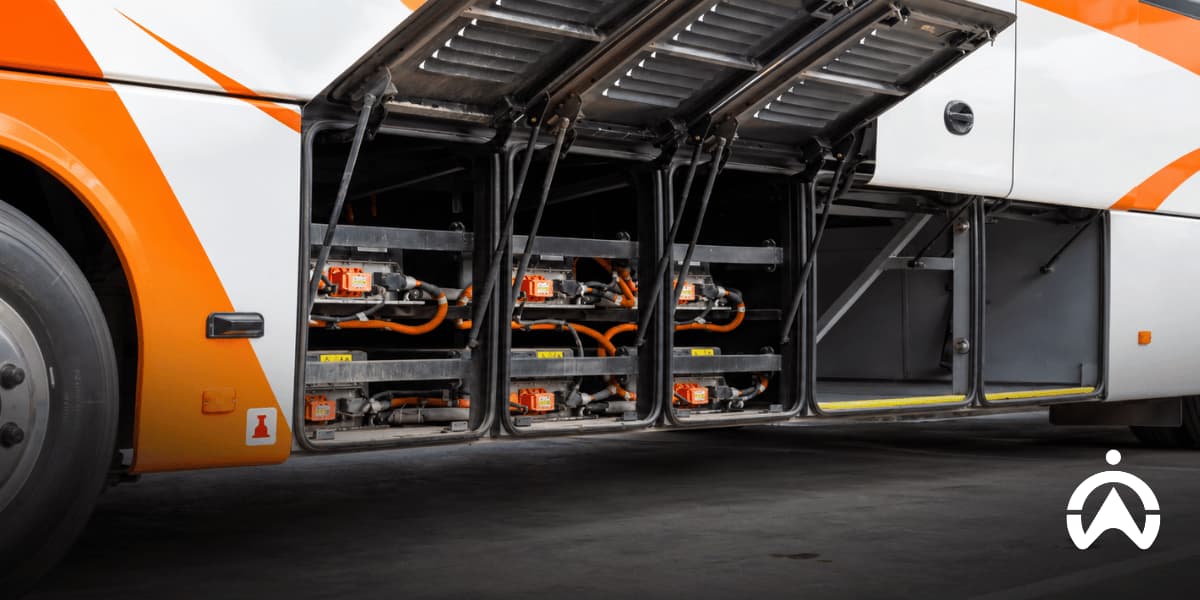 Open bus compartments showing batteries and electrical components used to assess electric fleet conversion costs and calculate fleet electrification ROI.