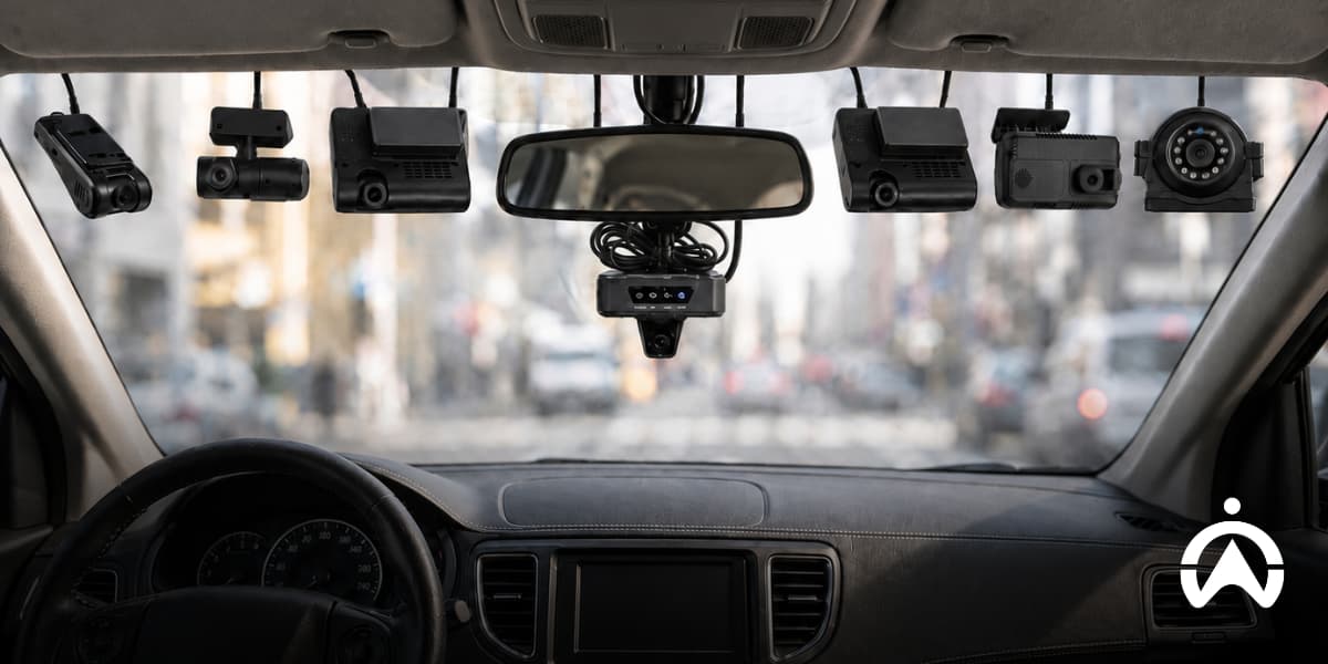 Multiple dashcams mounted across a car’s windshield and rearview mirror, illustrating dashcam lifespan and camera setup.