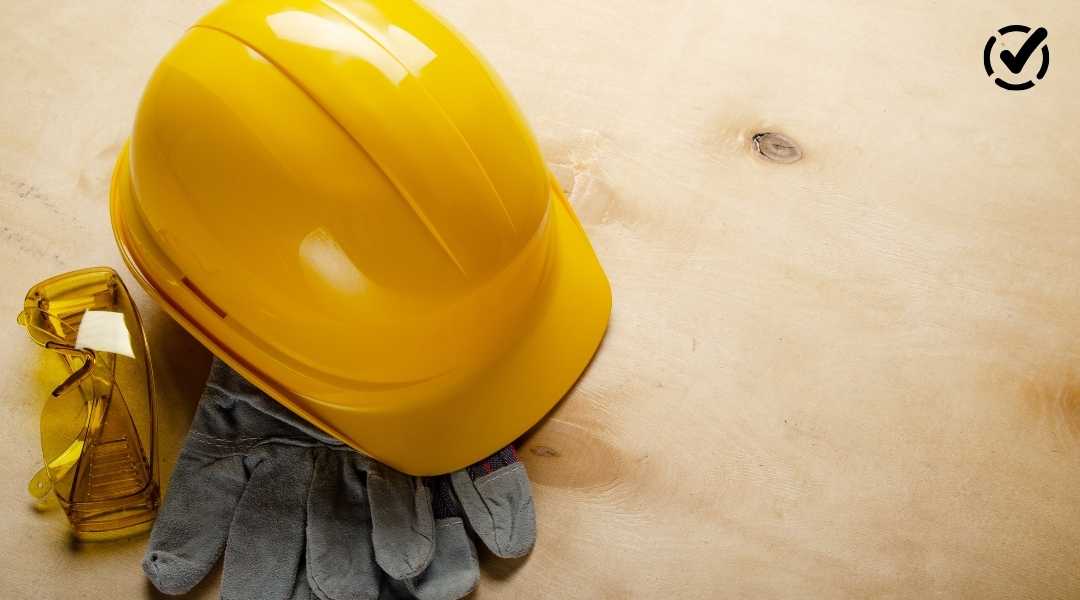 "A bright yellow hard hat, gray work gloves, and yellow safety glasses rest on a light wood surface, with the Formative by Newsela logo in the top right corner."