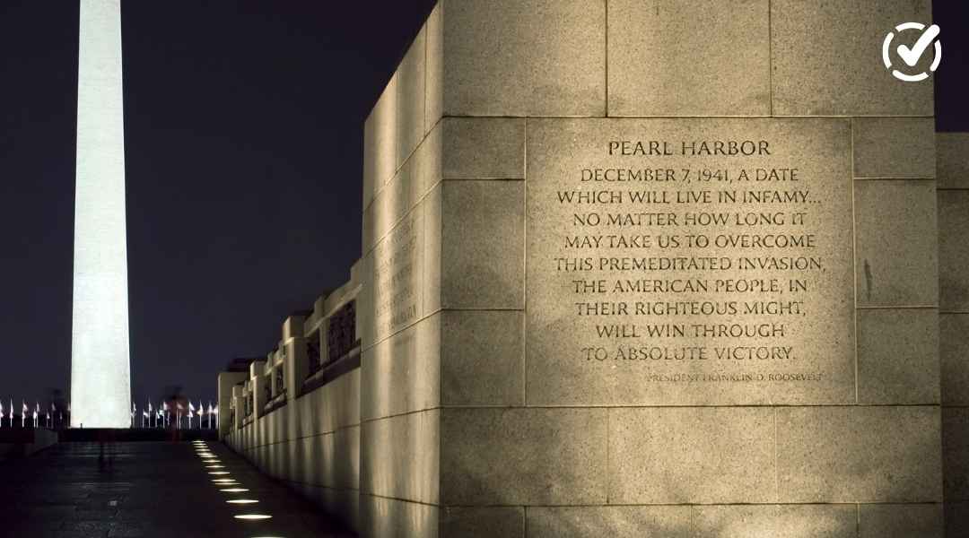 "A close-up of a stone monument engraved with Franklin D. Roosevelt's 'Pearl Harbor: A Date Which Will Live in Infamy' speech, with the Washington Monument blurred in the background against a dark sky. The Formative by Newsela logo is in the top right corn