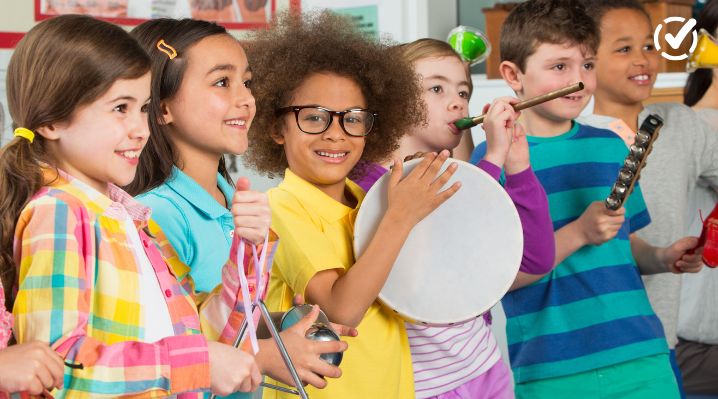 Elementary students playing classroom instruments during a music elective class, showing assessment ideas for specials teachers
