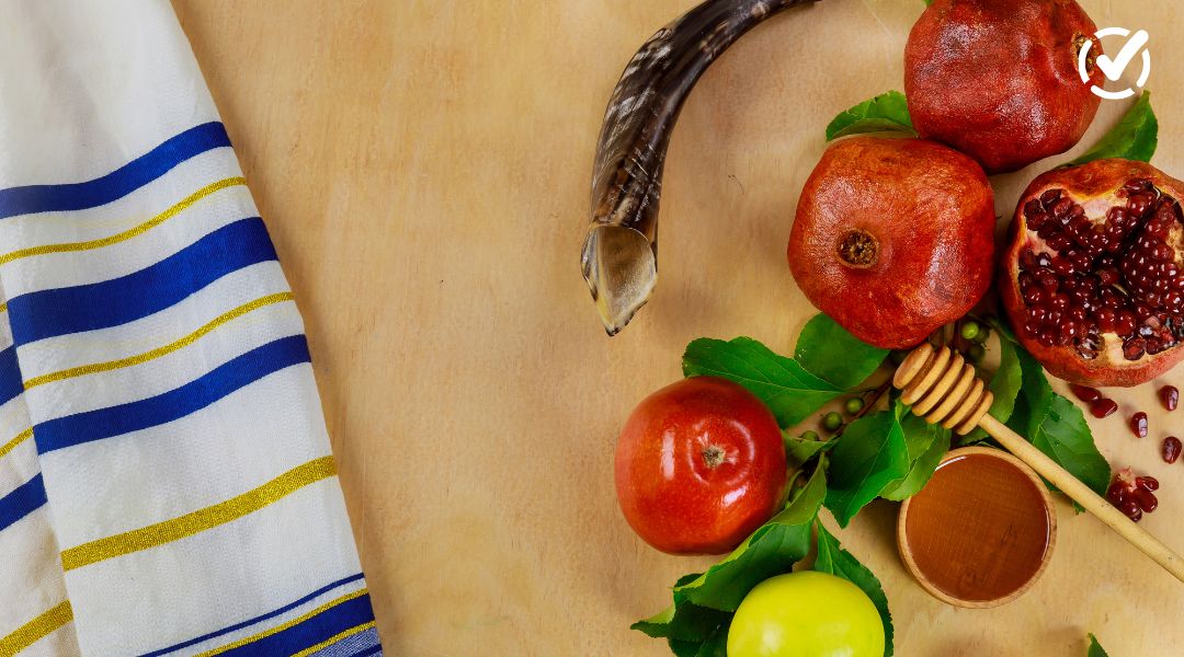 Shofar, tallit, pomegranates, apples, and honey for Rosh Hashanah and Yom Kippur student activities.