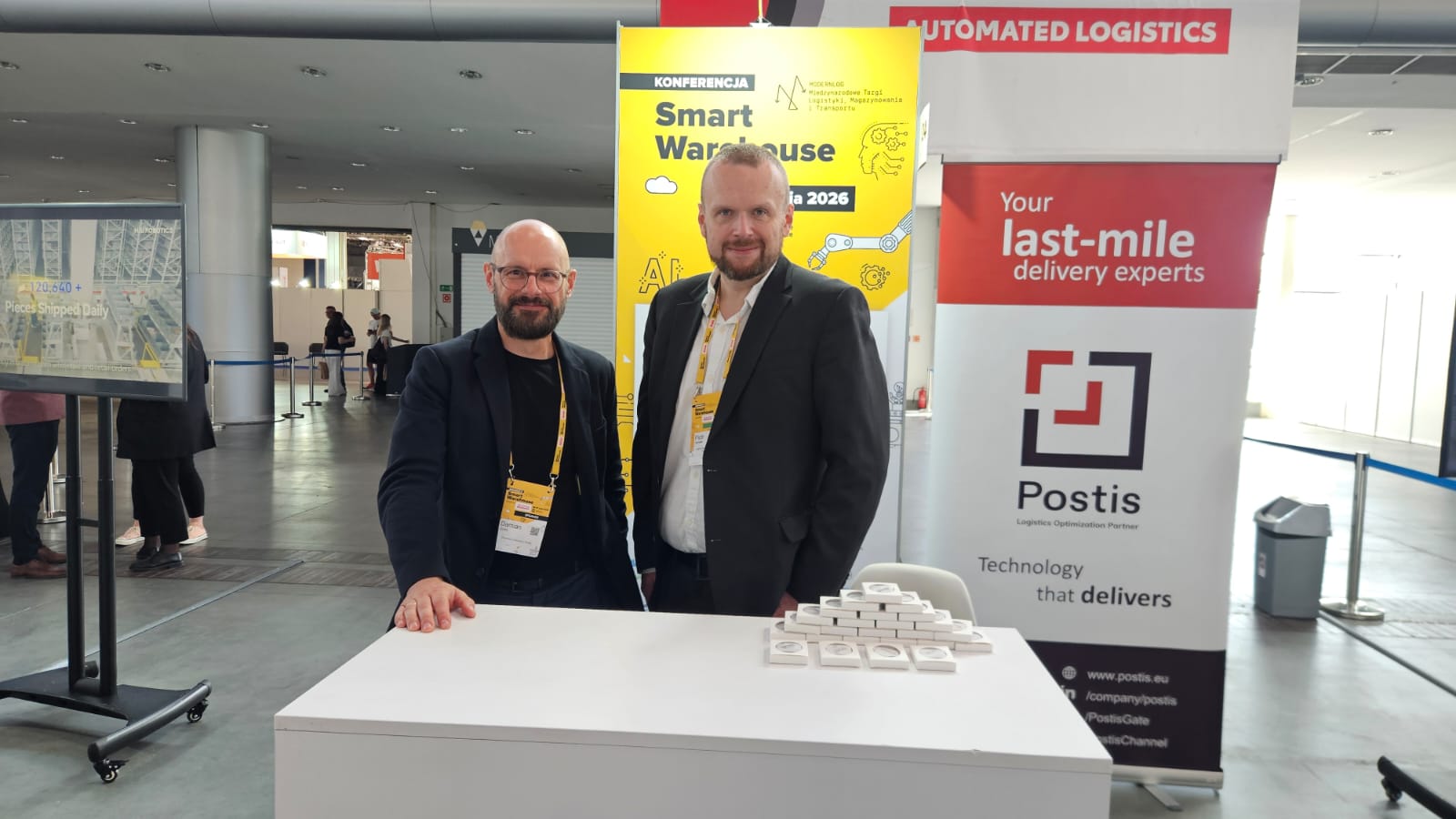 Postis joined Smart Warehouse Community 2026 powered by Toyota Automated Logistics in Poznań as a Silver Partner, represented by Damian Siusta and Piotr Gendek.