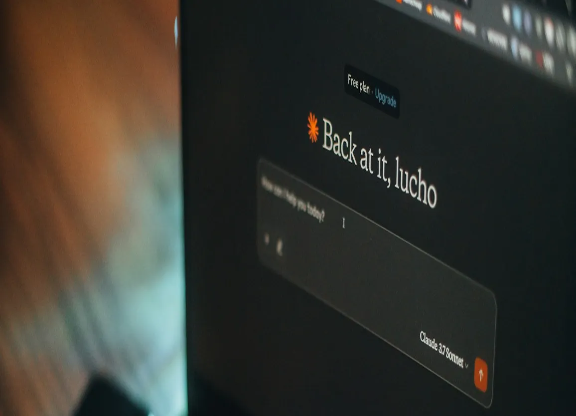 Close-up of a computer screen displaying a dark-themed interface with a prompt input box.