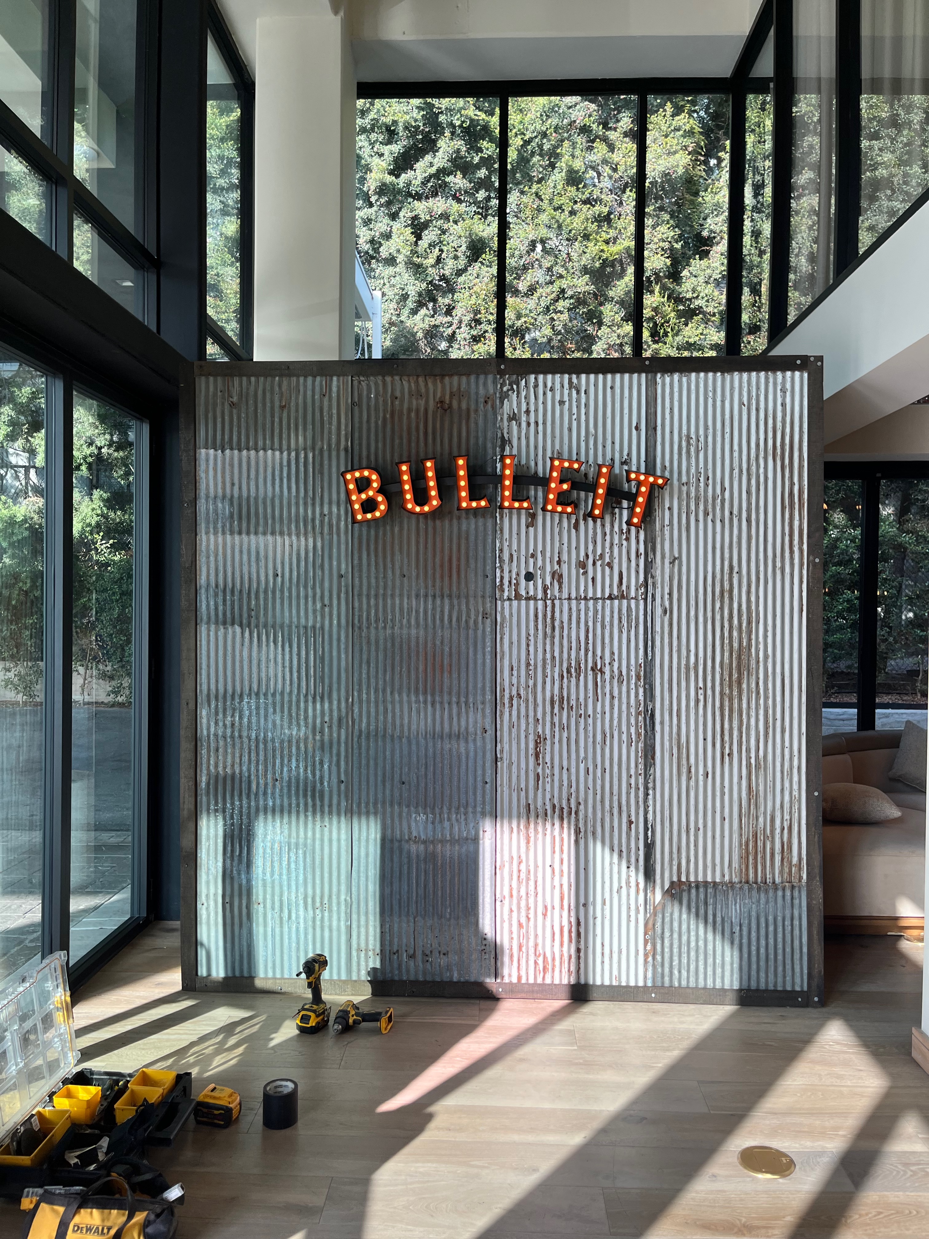 Fabricated background for Bulleit event. Corigated steel and lit up text 