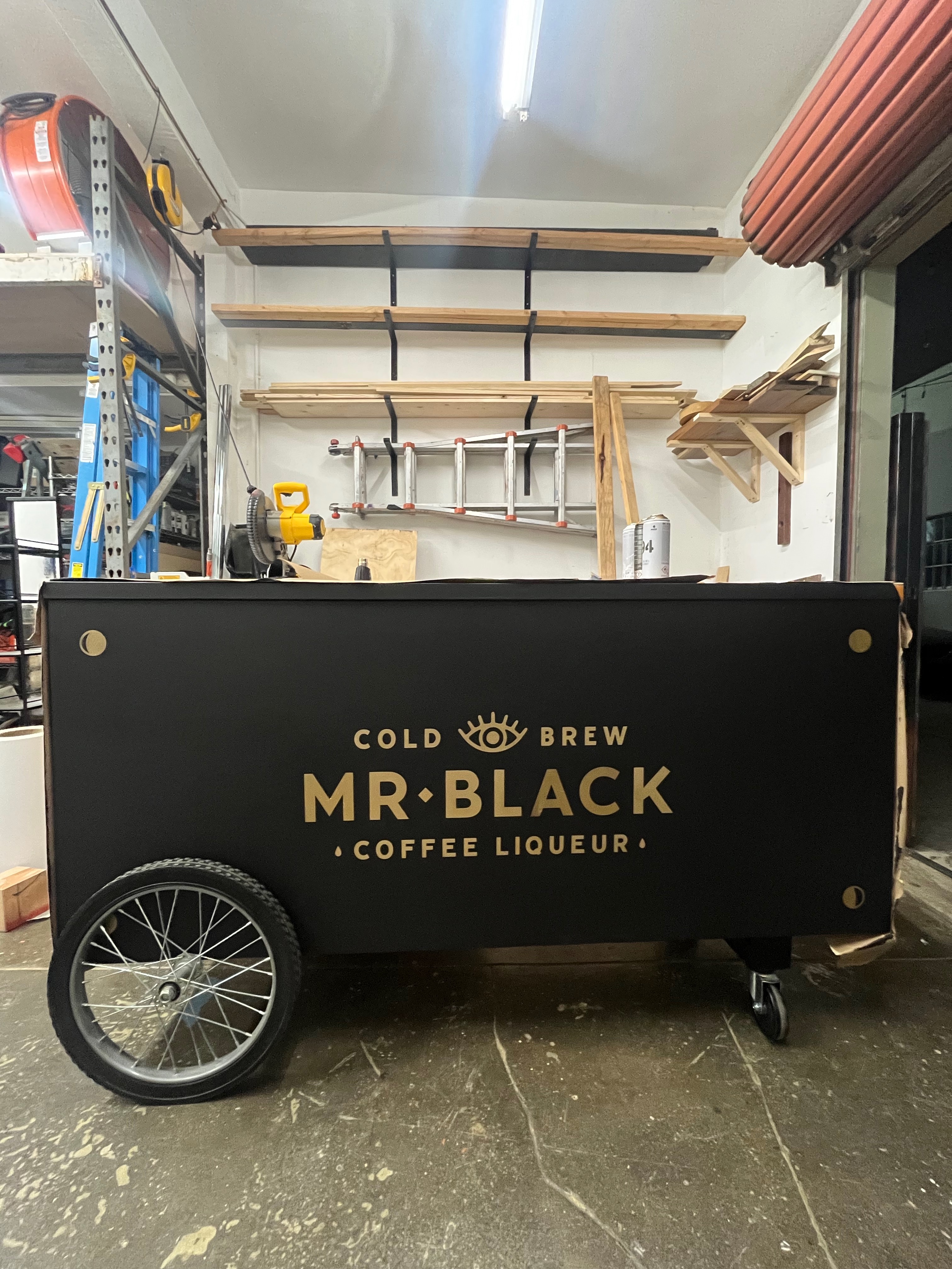 back cart with wheel with Mr Black Coffee Liqeur logo