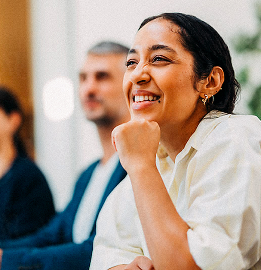 Smiling woman listening.