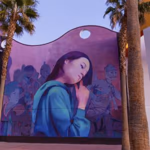 Mural of a young woman touching her hair