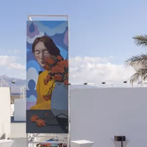 Mural of a woman next to a vase of flowers