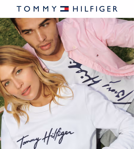 man and woman lounging together wearing pink and white tommy hilfiger